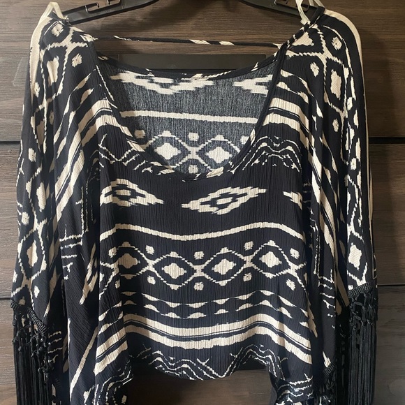 Flowy crop with tassel sleeves and scoop back. - Picture 2 of 2